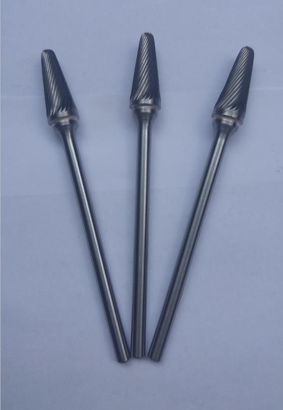 Carbide burrs with machine ground cutting flutes